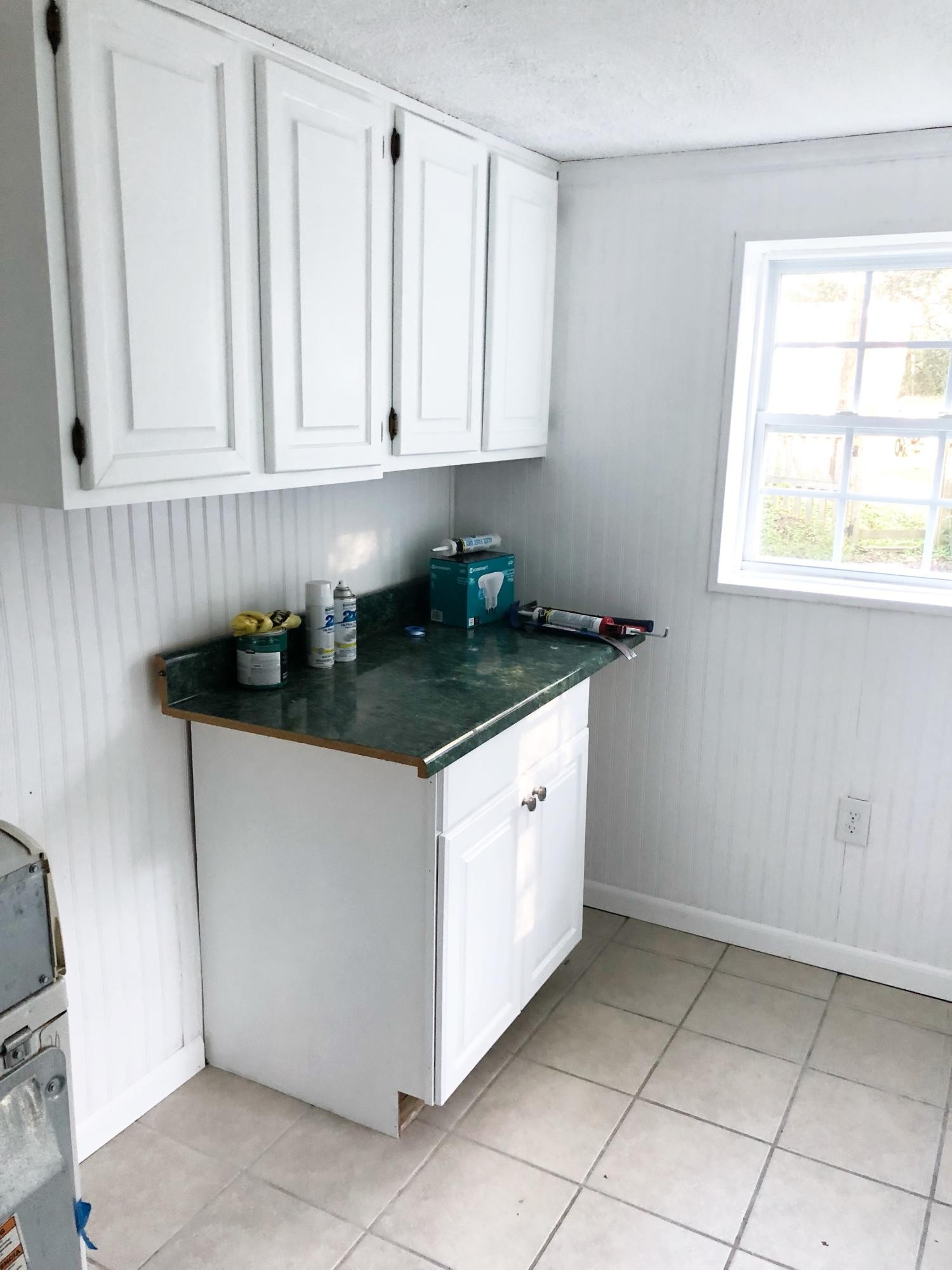 304 Lee Road Clinton, TN 37716 - Photo 8 of 21 a kitchen with granite countertop white cabinets and a sink