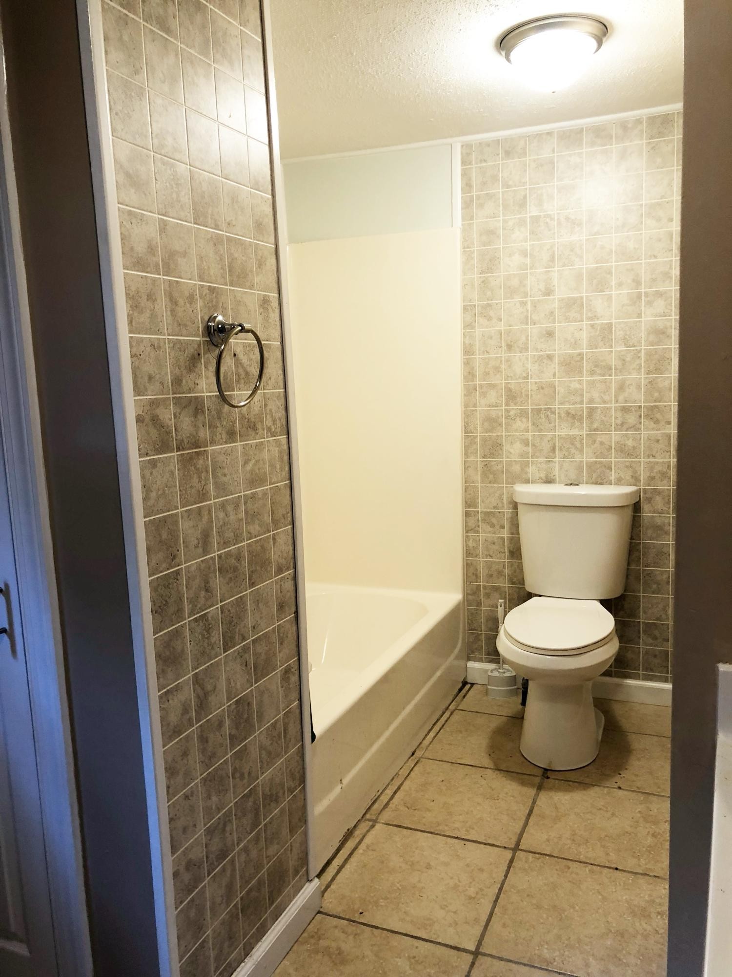 304 Lee Road Clinton, TN 37716 - Photo 10 of 21 a bathroom with a toilet and a shower