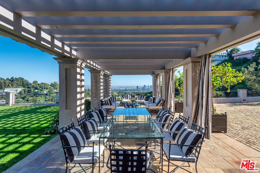 980 Stradella Road Los Angeles, CA 90077 - Photo 26 of 40 a view of a dining room with furniture window and outside view