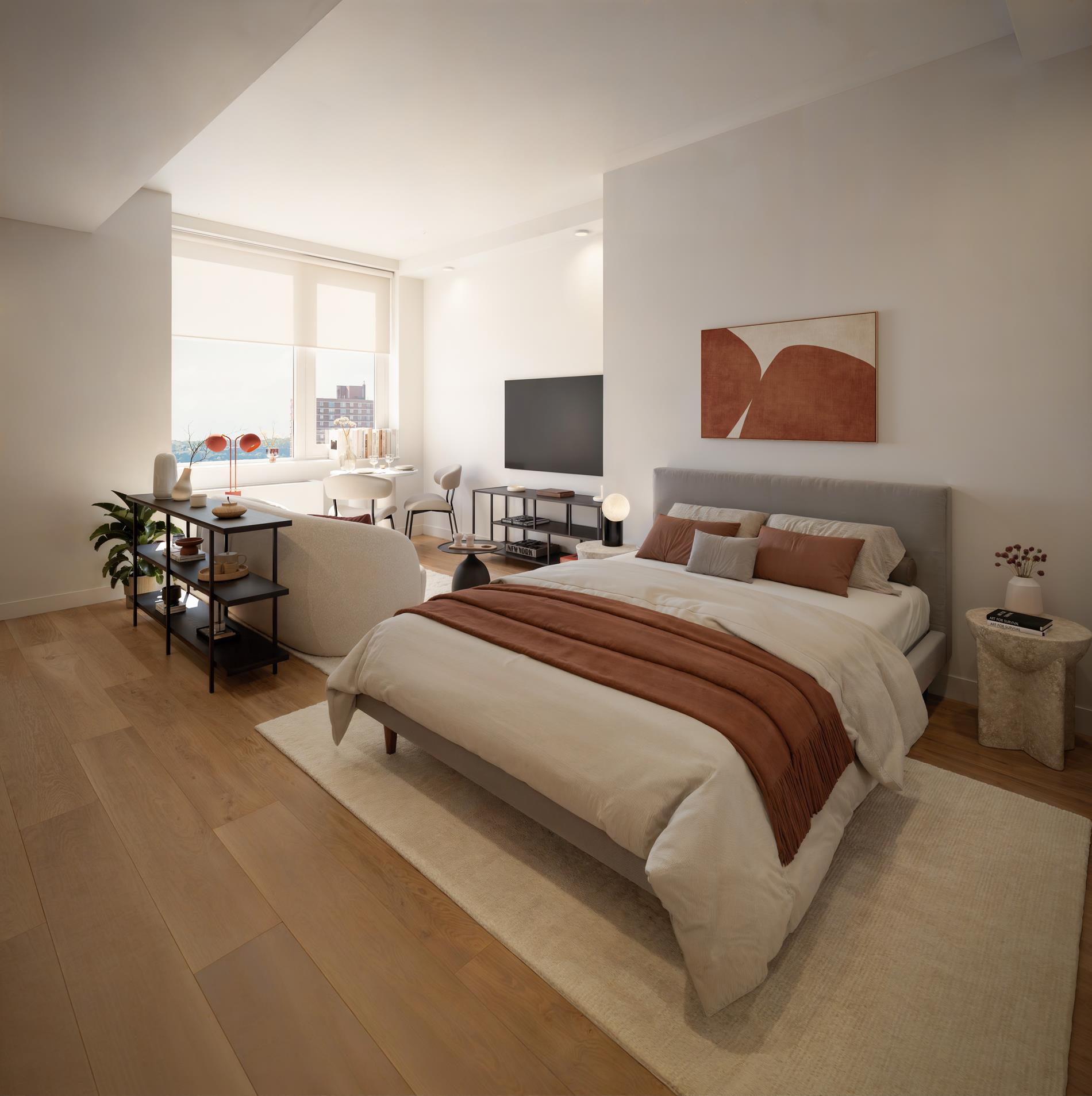 1440 Amsterdam Avenue, Unit 2218 Manhattan, NY 10027 - Photo 3 of 20 a bedroom with a bed and a couch