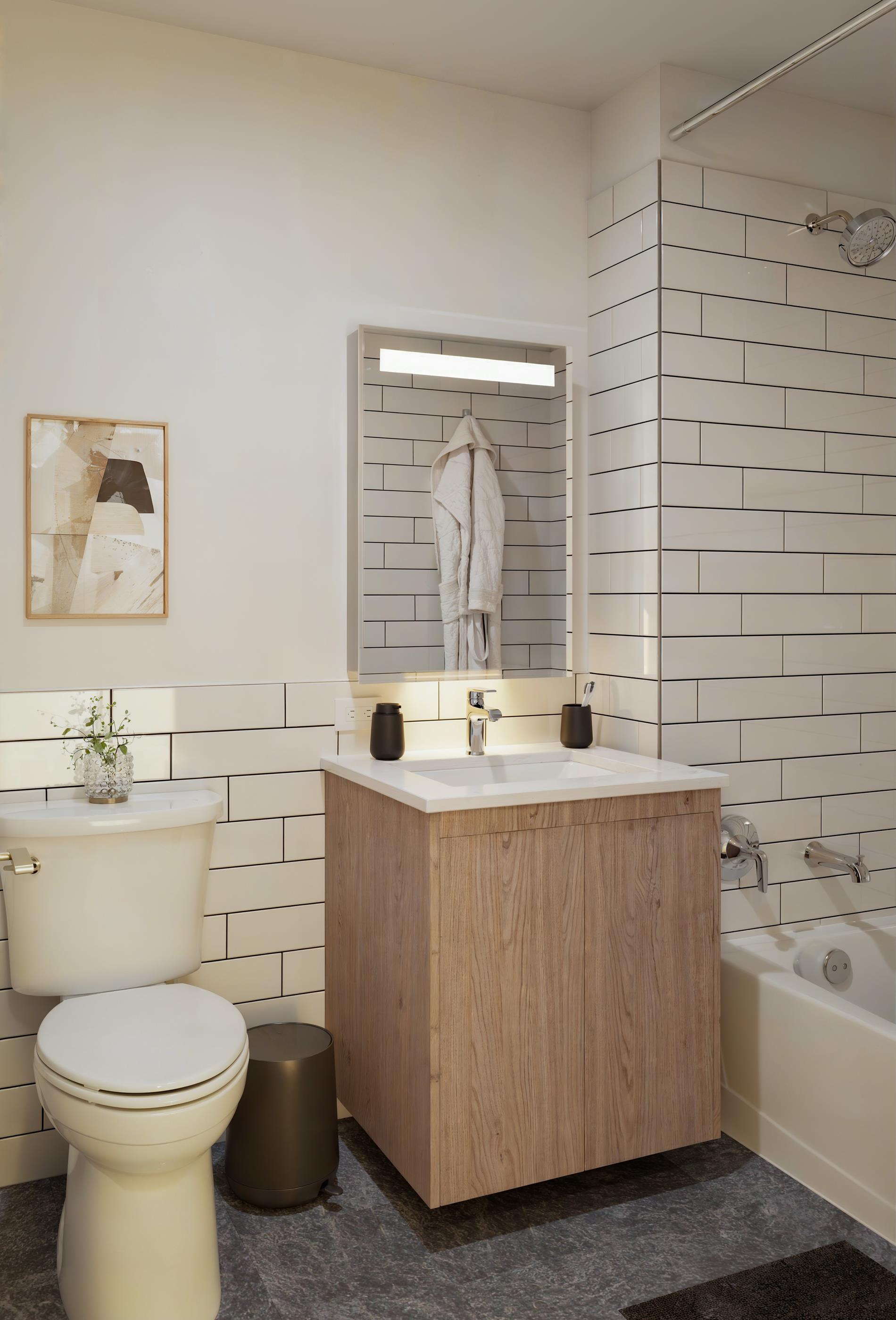 1440 Amsterdam Avenue, Unit 2218 Manhattan, NY 10027 - Photo 5 of 20 a bathroom with a sink a toilet and bathtub