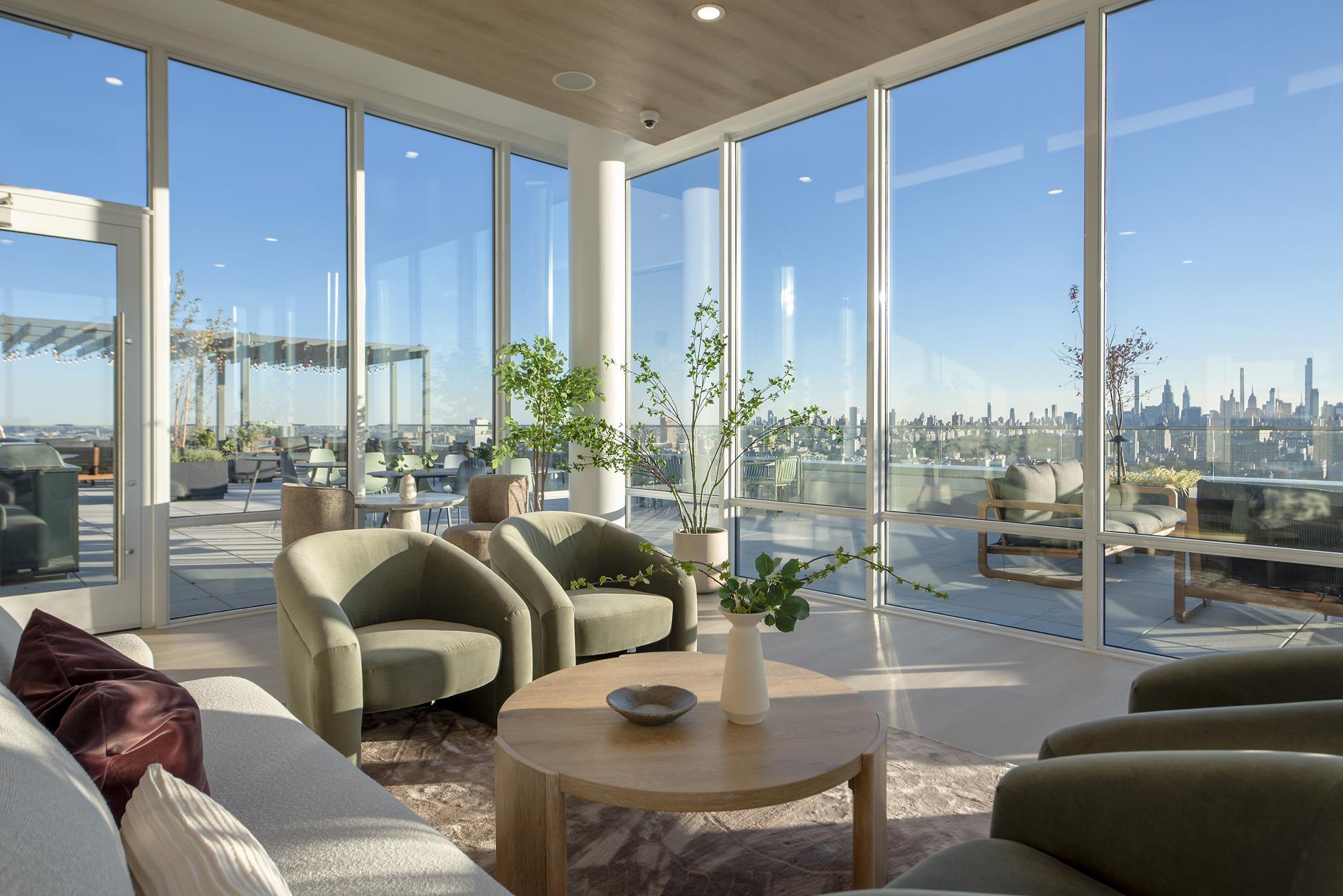 1440 Amsterdam Avenue, Unit 2218 Manhattan, NY 10027 - Photo 8 of 20 a living room with furniture and a large window