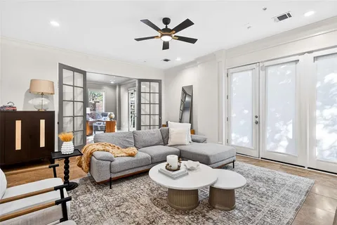 a living room with furniture and a rug