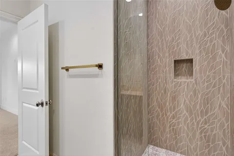 an empty room with windows and cabinet