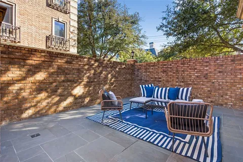 a view of balcony with wooden floor and outdoor seating
