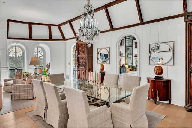 a view of a livingroom with furniture window and wooden floor