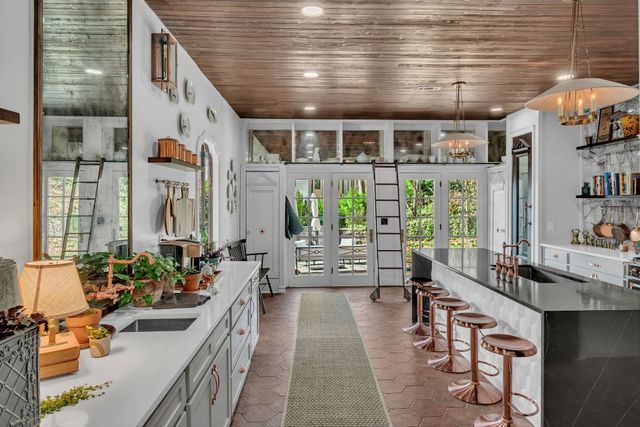 a lobby with furniture and floor to ceiling window
