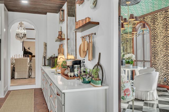 a kitchen with stainless steel appliances kitchen island granite countertop a stove and cabinets