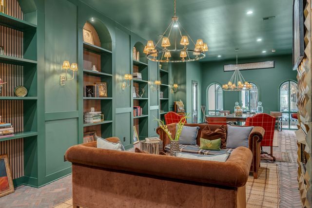 a living room with fireplace furniture and a flat screen tv