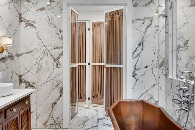 a bedroom with a bed dresser and a window