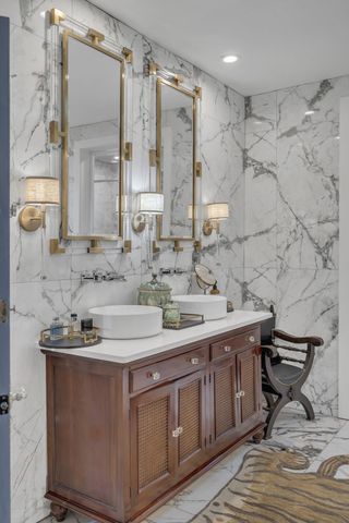 a bathroom with a double vanity sink and a mirror