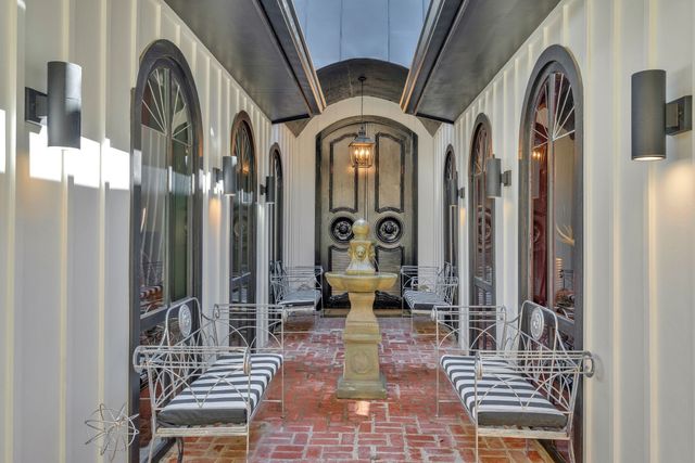 a view of deck with furniture and trees