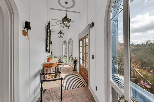 a view of a balcony with furniture