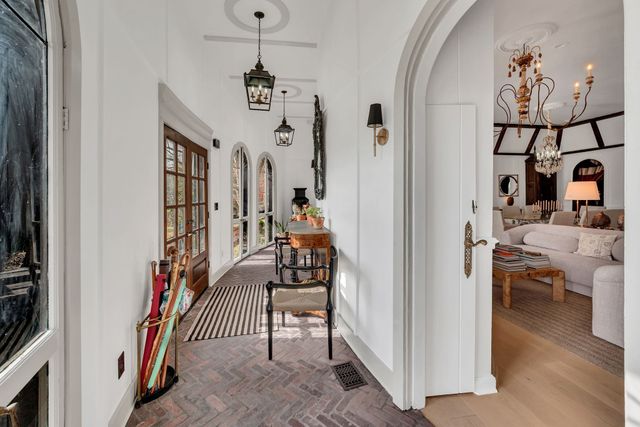 a view of a livingroom with furniture and staircase
