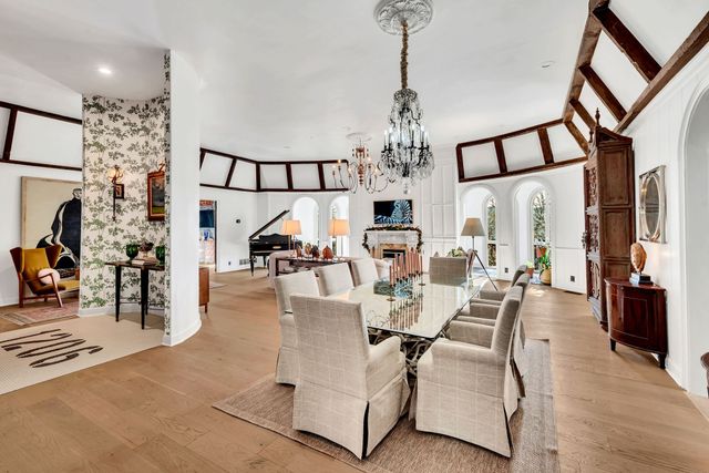a view of a livingroom with furniture and a chandelier