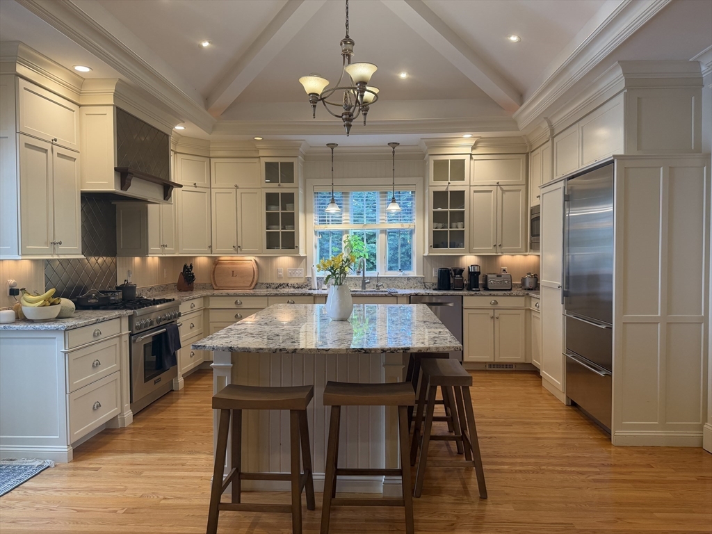 65 Denton Road Wellesley, MA 02482 - Photo 5 of 16 a kitchen with granite countertop a counter space stainless steel appliances and cabinets