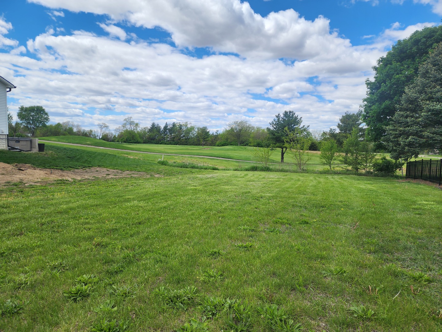 61 Pebblebrook Court Bloomington, IL 61705 - Photo 1 of 2 a view of a golf course with a lake