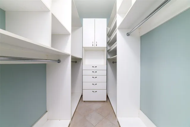 a view of a hallway with closet