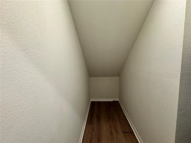 a view of house with entryway and windows