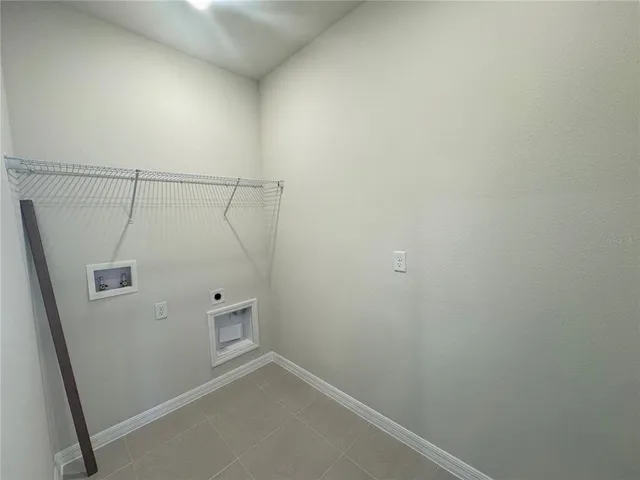a view of a kitchen with a sink and a window