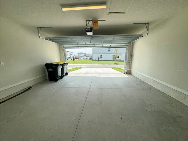 a view of a house with a door and wooden floor