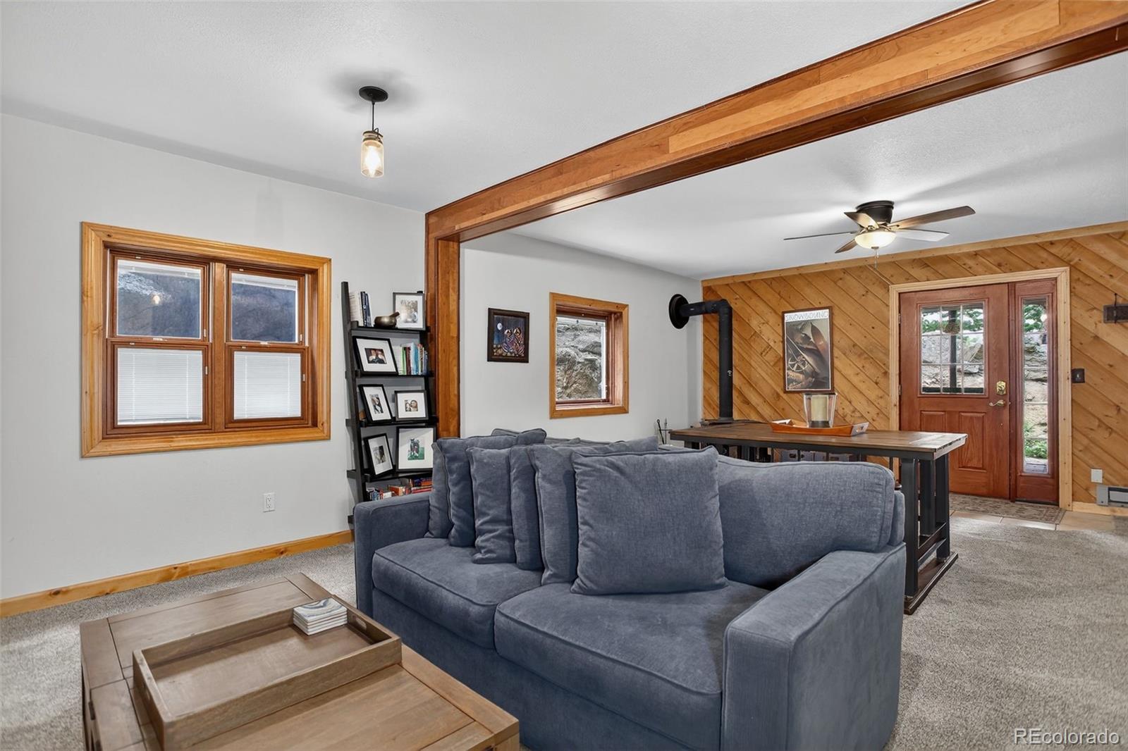 31911 Warrens Road Golden, CO 80403 - Photo 20 of 42 a living room with furniture and large window
