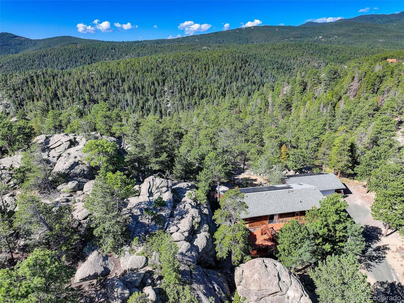 31911 Warrens Road Golden, CO 80403 - Photo 33 of 42 an aerial view of a house with a yard