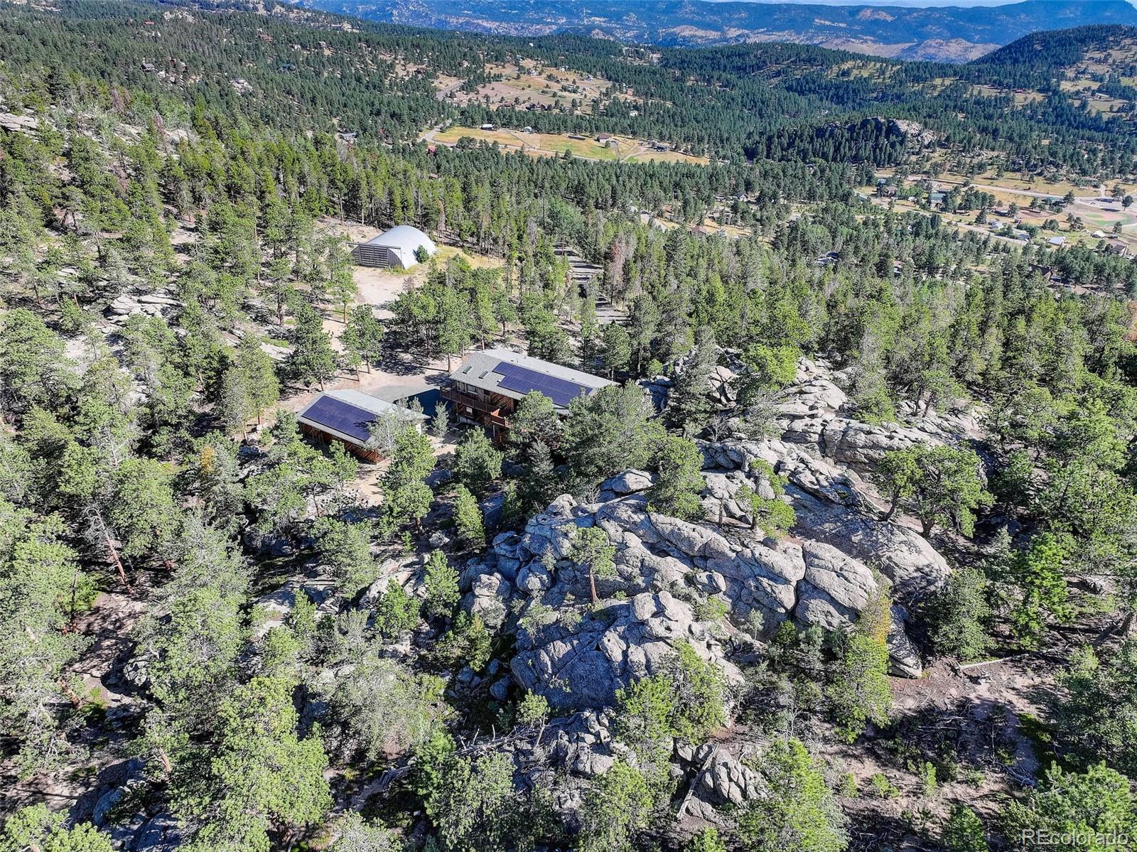 31911 Warrens Road Golden, CO 80403 - Photo 37 of 42 a view of a forest with a lake