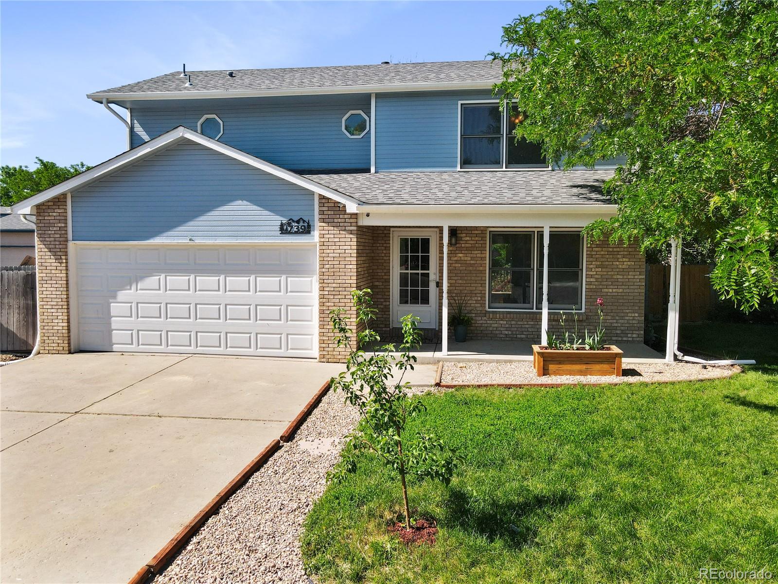 a house view with a garden space