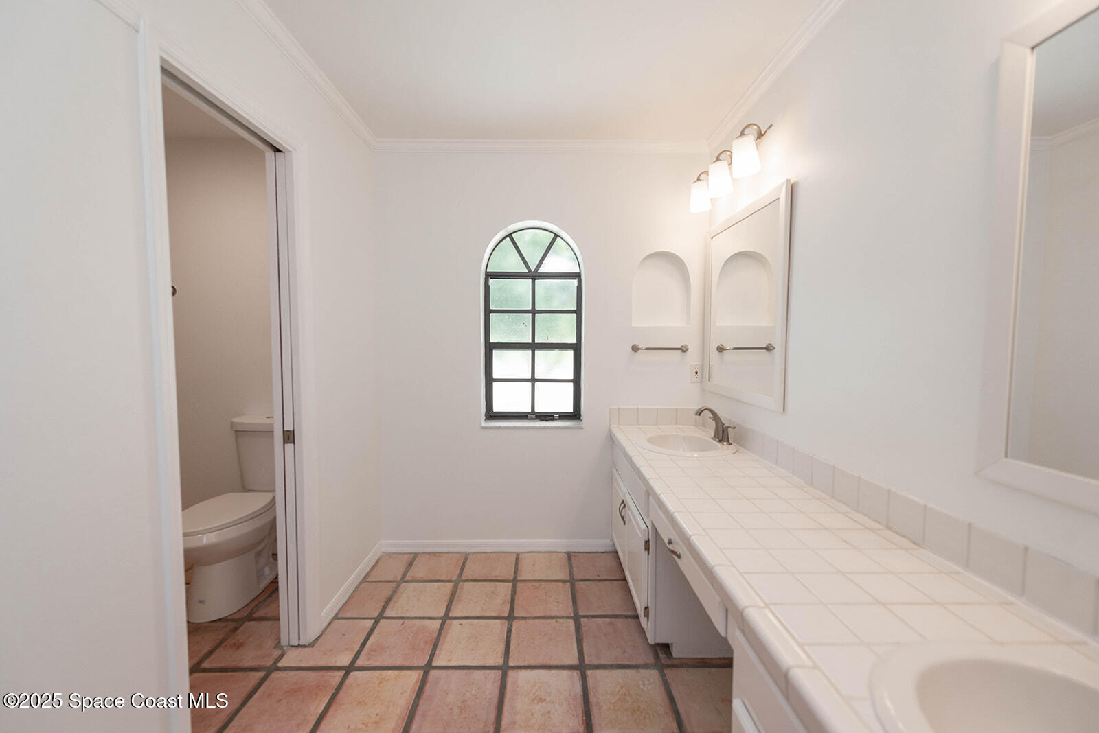 6 Point View Place Cocoa, FL 32926 - Photo 14 of 27 a spacious bathroom with a granite countertop sink a toilet and a vanity