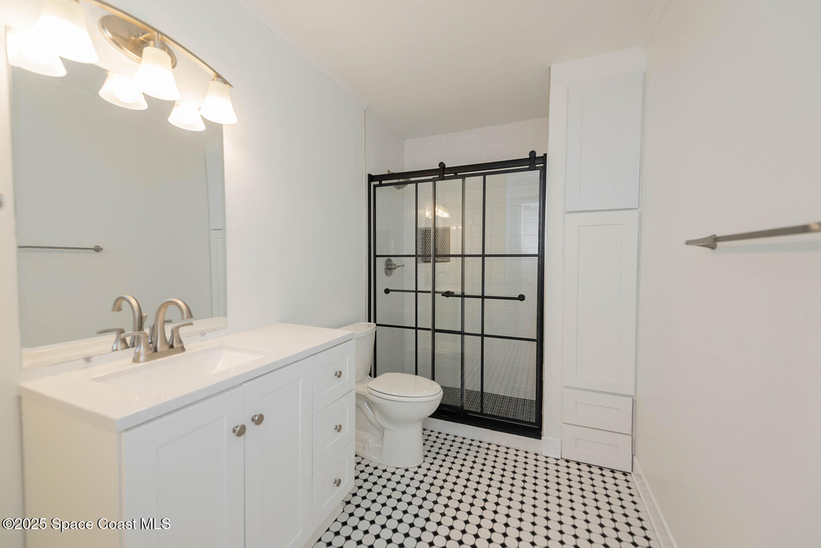 6 Point View Place Cocoa, FL 32926 - Photo 19 of 27 a bathroom with a sink a toilet and shower