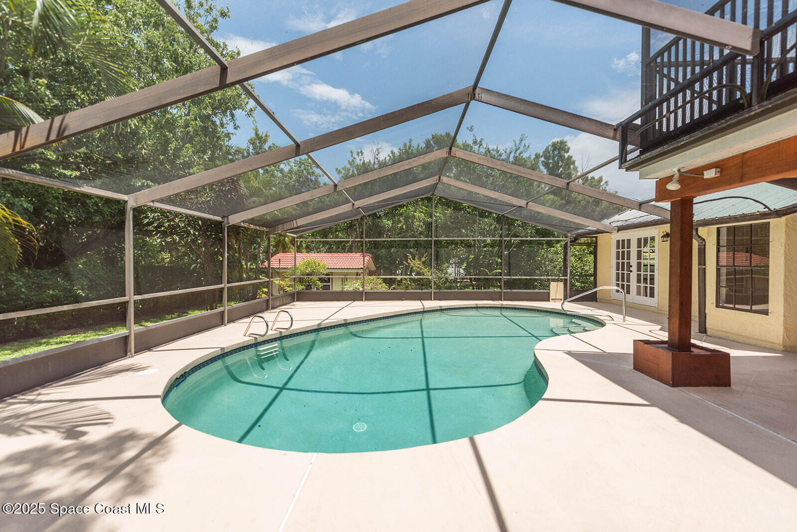 6 Point View Place Cocoa, FL 32926 - Photo 20 of 27 a view of a swimming pool with a patio