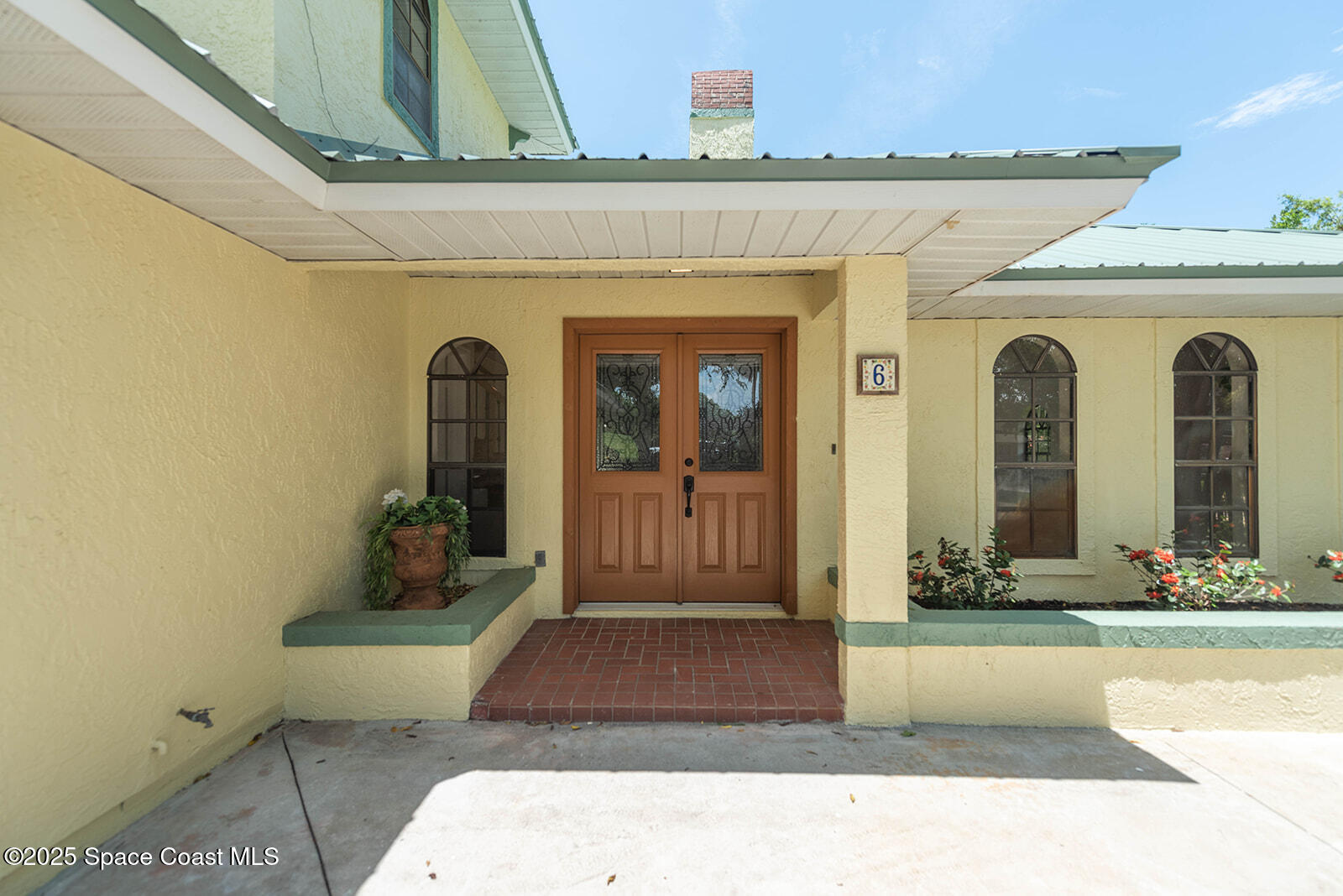 6 Point View Place Cocoa, FL 32926 - Photo 3 of 27 a front view of a house with a yard