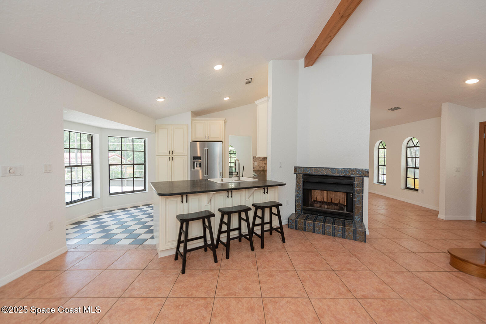 6 Point View Place Cocoa, FL 32926 - Photo 5 of 27 a open kitchen with granite countertop a sink cabinets and stove top oven