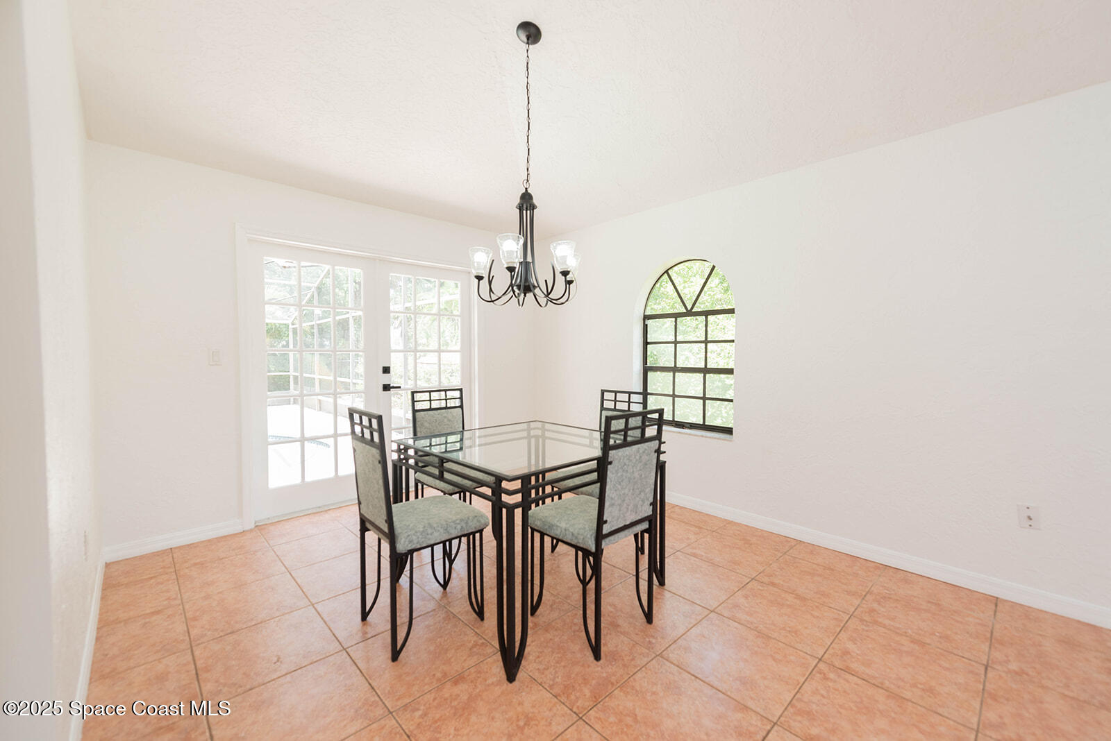 6 Point View Place Cocoa, FL 32926 - Photo 9 of 27 a view of a dining room with furniture and wooden floor