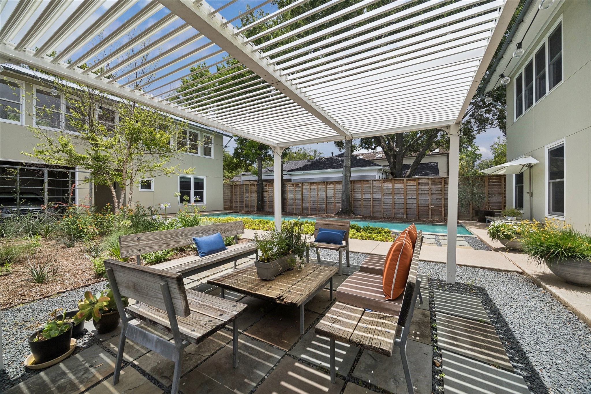 1418 Kipling Street Houston, TX 77006 - Photo 24 of 42 Another view from underneath the pergola. This view really displays how the parallel structures work together to form one cohesive living space.