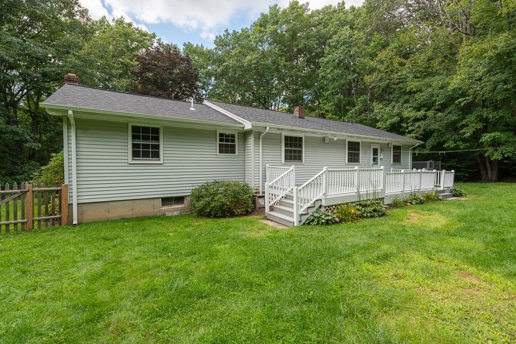 308 Erickson Road Ashby, MA 01431 - Photo 2 of 40 a backyard of a house with table and chairs