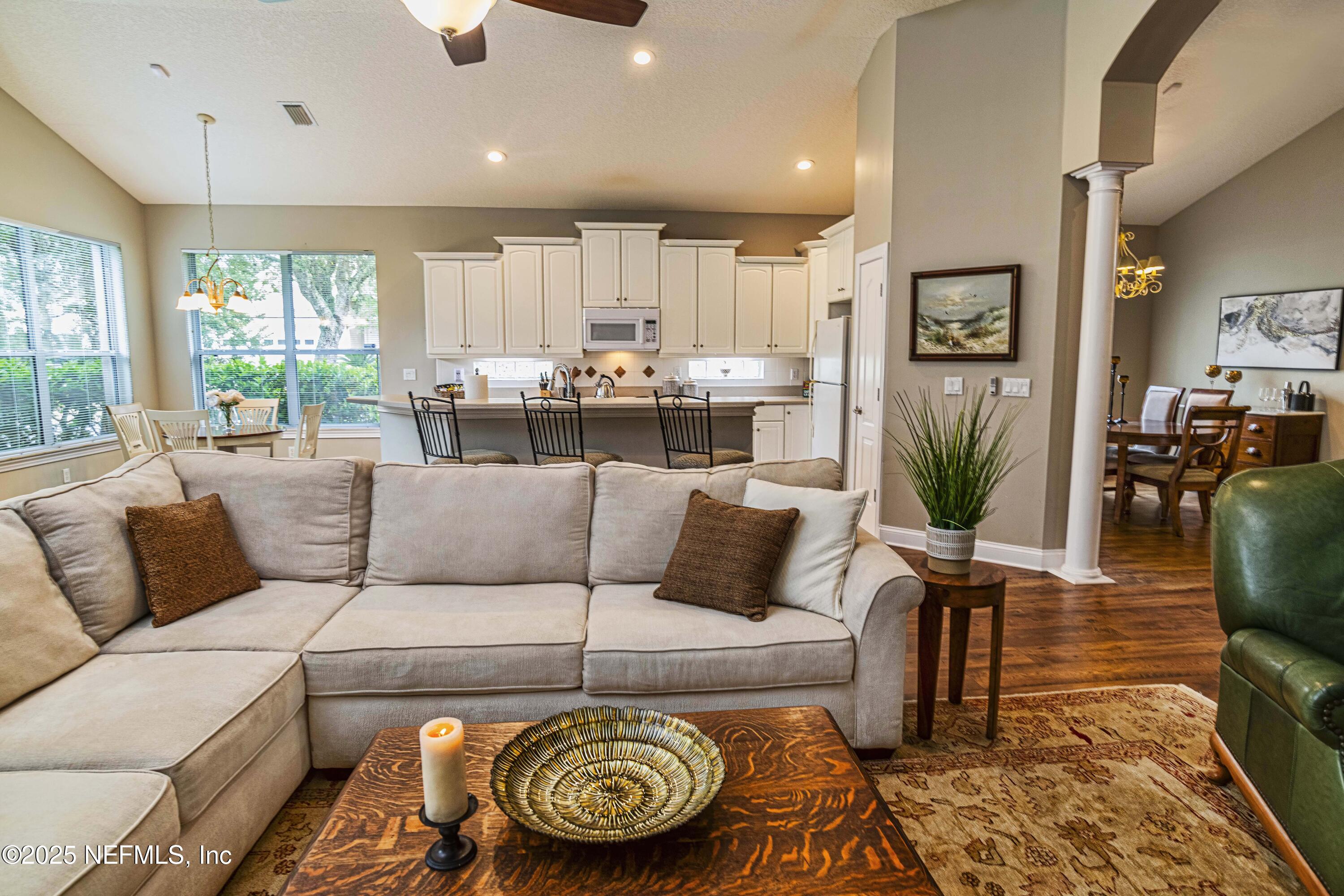 341 Island Green Drive St. Augustine, FL 32092 - Photo 13 of 49 a living room with furniture and a large window