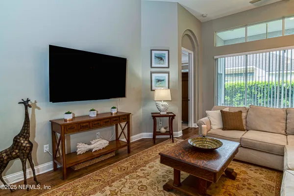 a living room with furniture and a flat screen tv