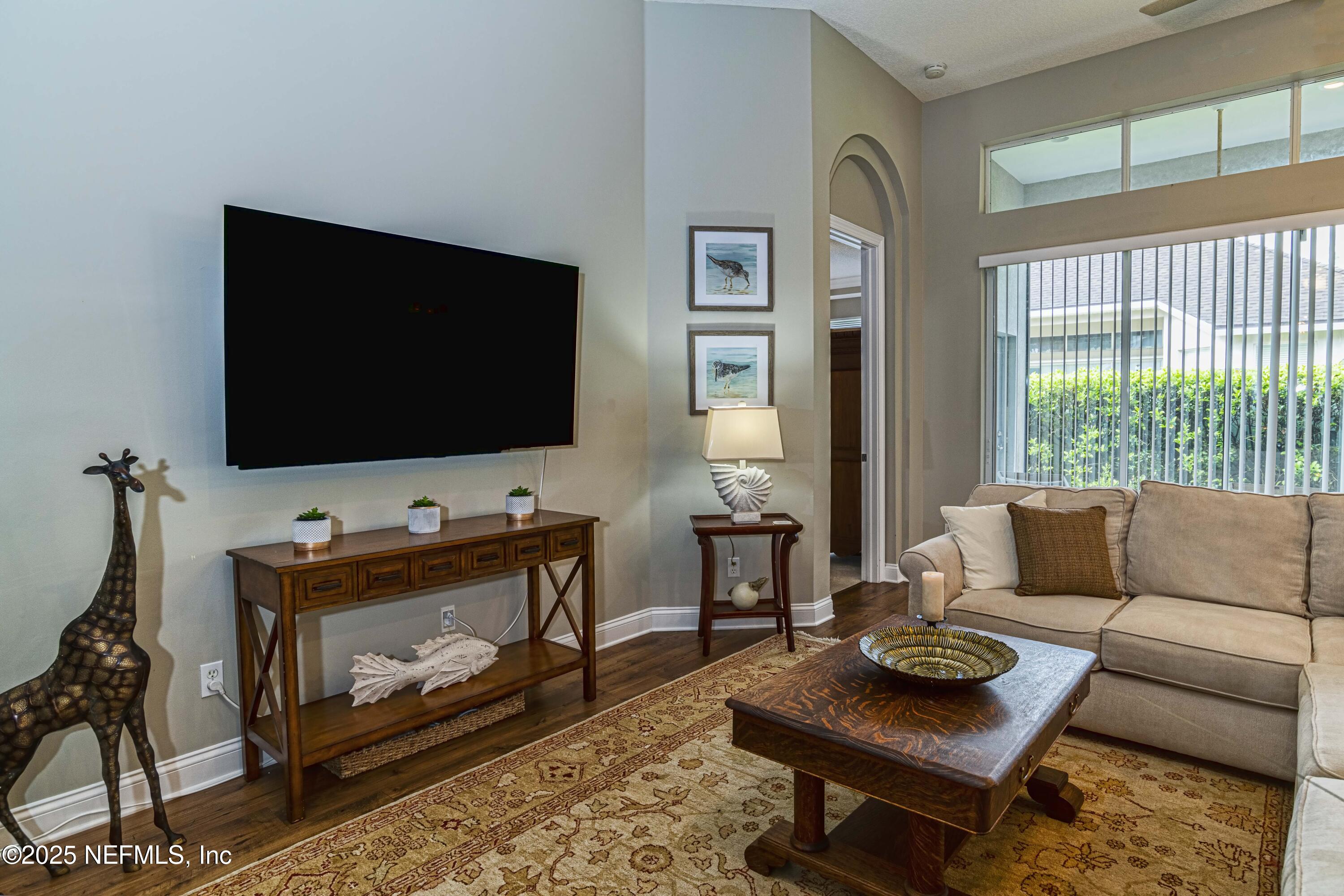 341 Island Green Drive St. Augustine, FL 32092 - Photo 14 of 49 a living room with furniture and a flat screen tv