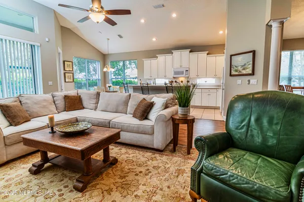 a living room with furniture and a large window