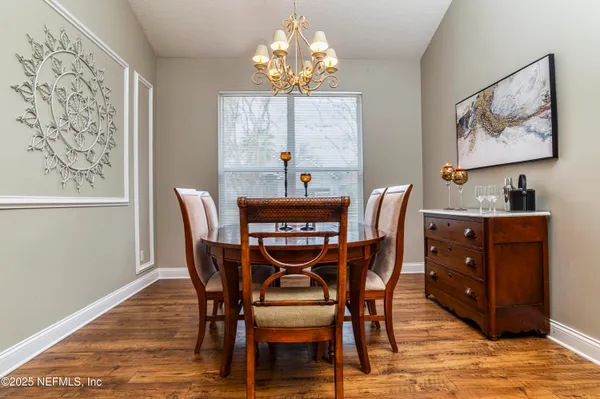 a dining room with furniture and window