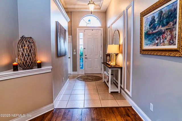 a view of living room with furniture and wooden floor