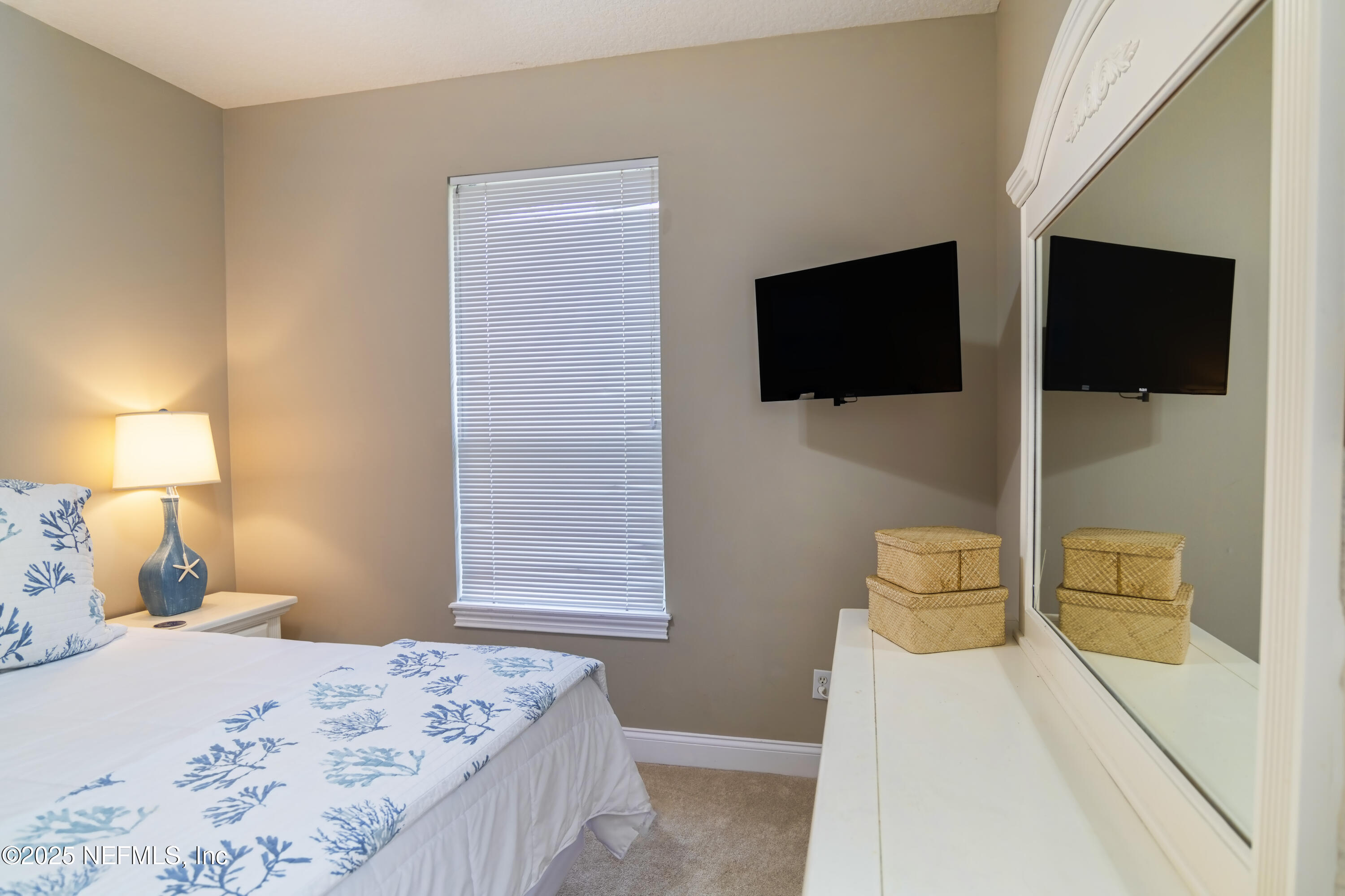 341 Island Green Drive St. Augustine, FL 32092 - Photo 23 of 49 a bedroom with a bed and flat screen tv