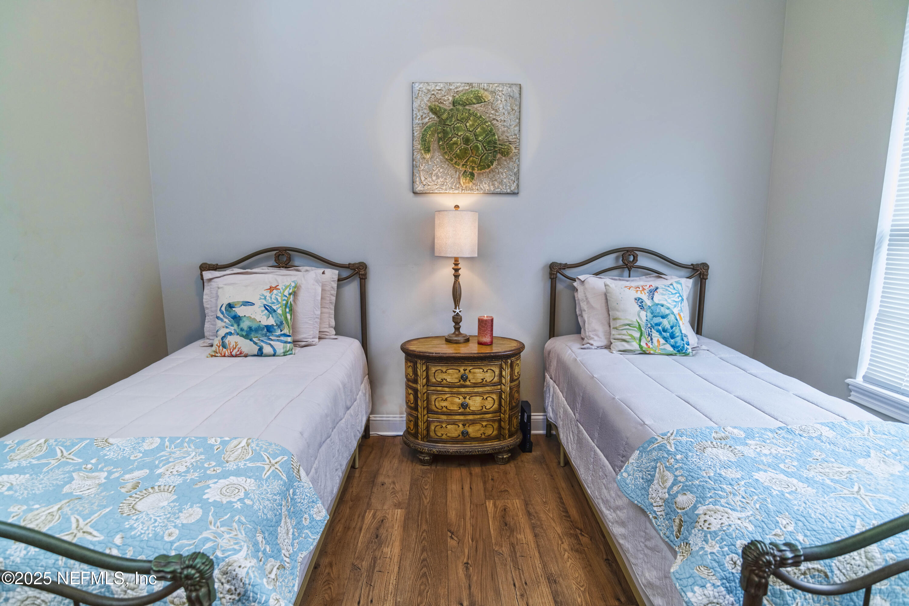 341 Island Green Drive St. Augustine, FL 32092 - Photo 24 of 49 a bedroom with a bed and wooden floor