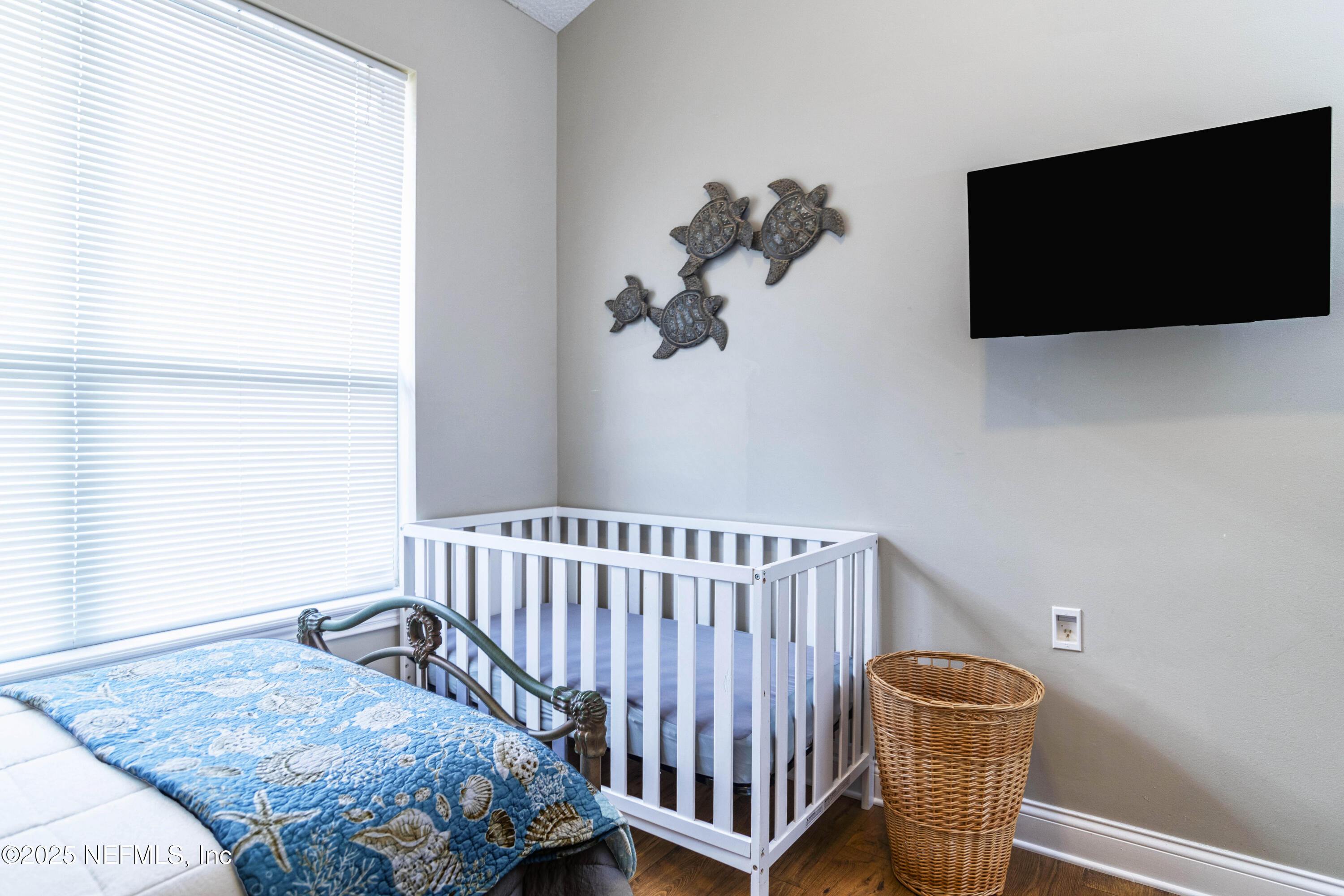 341 Island Green Drive St. Augustine, FL 32092 - Photo 25 of 49 a bedroom with a bed and flat screen tv