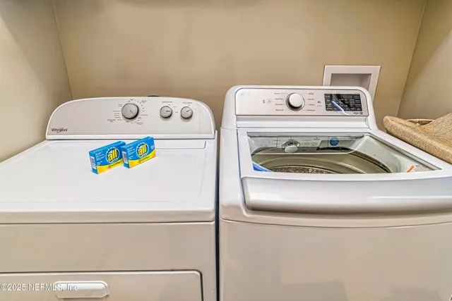 a utility room with dryer and washer