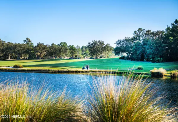 a view of a lake with a big yard