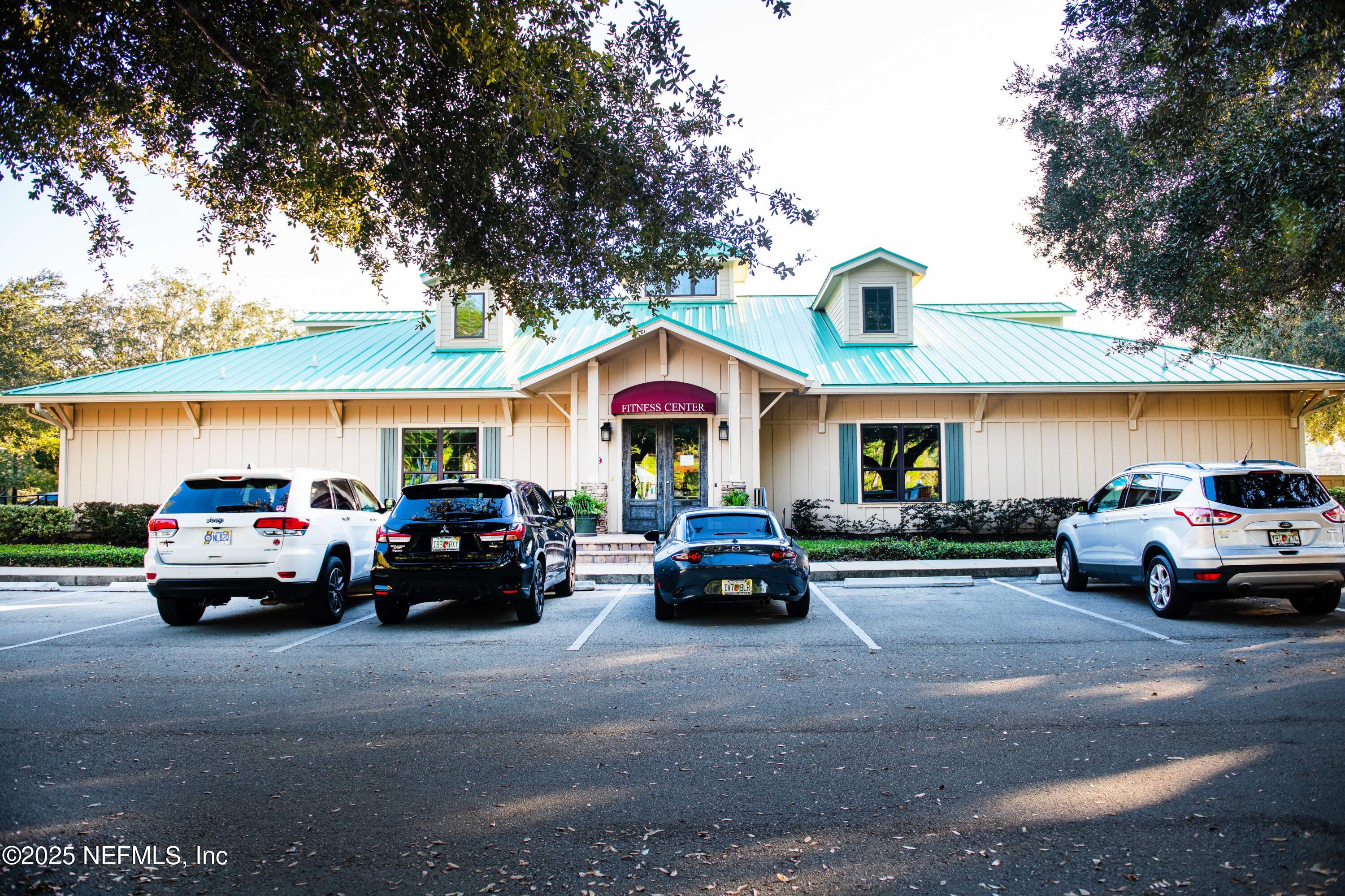 341 Island Green Drive St. Augustine, FL 32092 - Photo 47 of 49 a view of car parked in front of a house