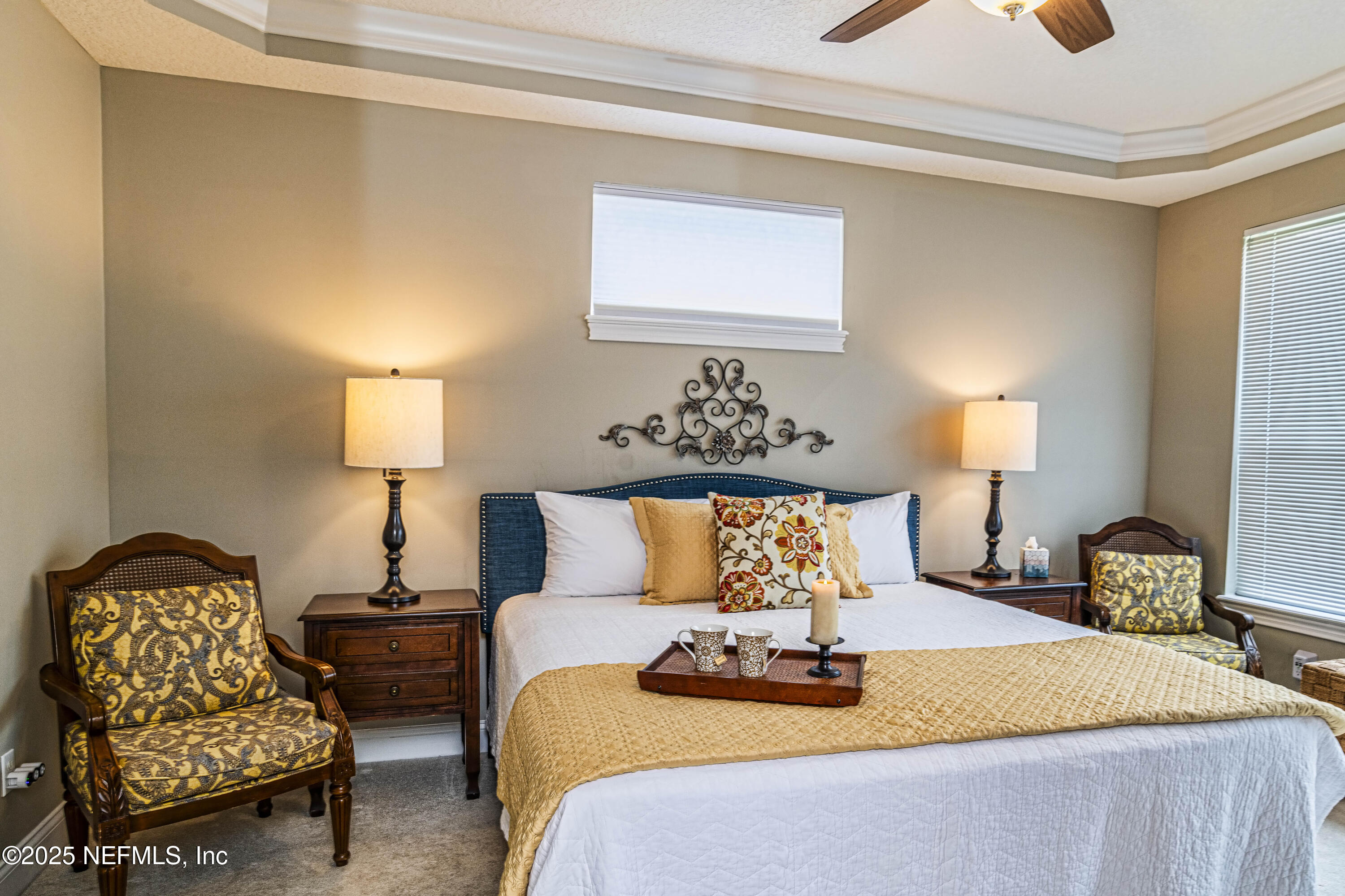 341 Island Green Drive St. Augustine, FL 32092 - Photo 6 of 49 a bedroom with bed and lamp